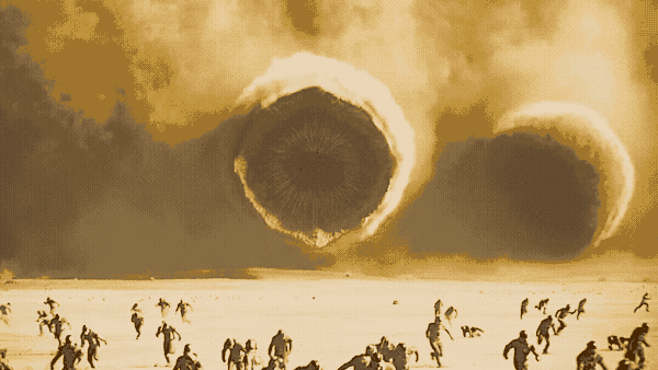 Some giant worms emerge from a sandstorm, bearing down on scattered spacesuit guys.