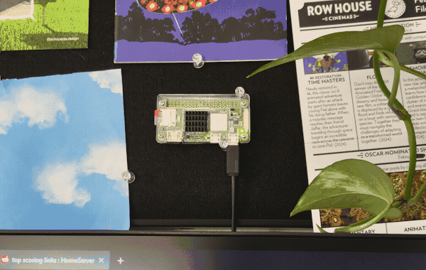 A Raspberry Pi (tiny computer about as big as a pack of gum) mounted to the bulletin board in my office