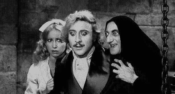 Gene Hackman as Frankenstein, Marty Feldman as Igor, and Teri Garr as Inga look at something offscreen