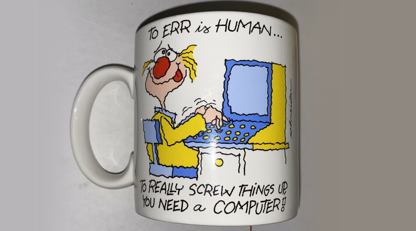 Coffee mug with artwork of a cartoon man zanily using a desktop computer, with the text: 'To err is human... To really screw things up, you need a computer!